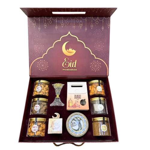 Eid Mubarak ramadan gift box with various items including jars and a lantern on a white background