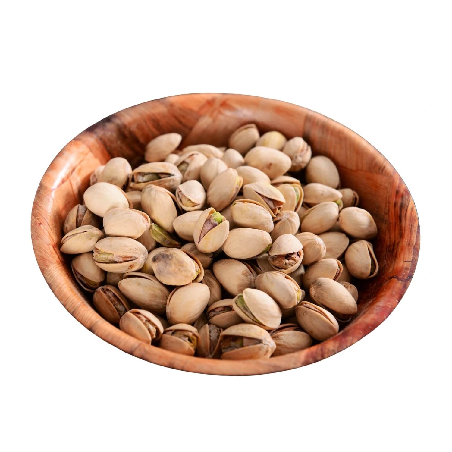 A wooden bowl filled with roasted pistachios