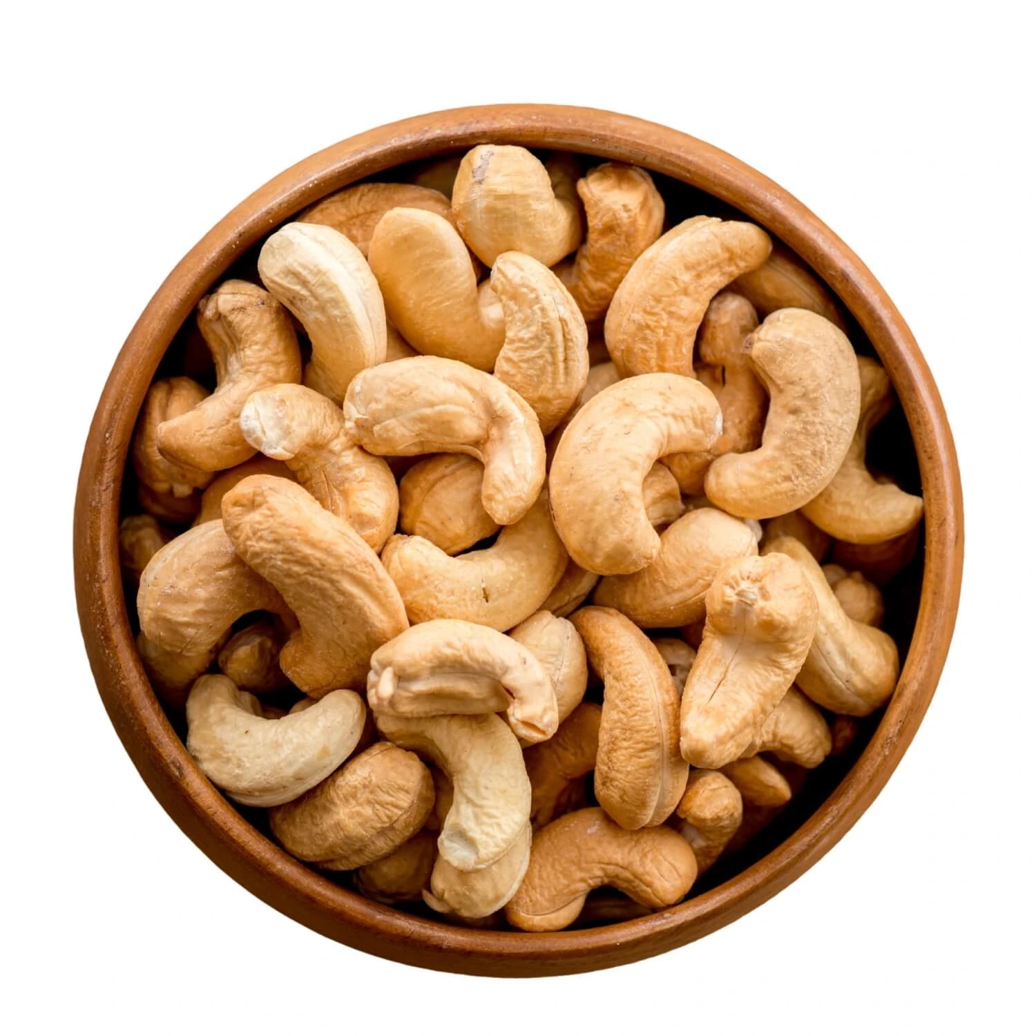 roasted cashews piled in a round wooden bowl.