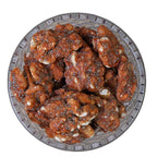 caramelized walnuts in a glass bowl