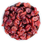 White bowl filled with dried cranberries