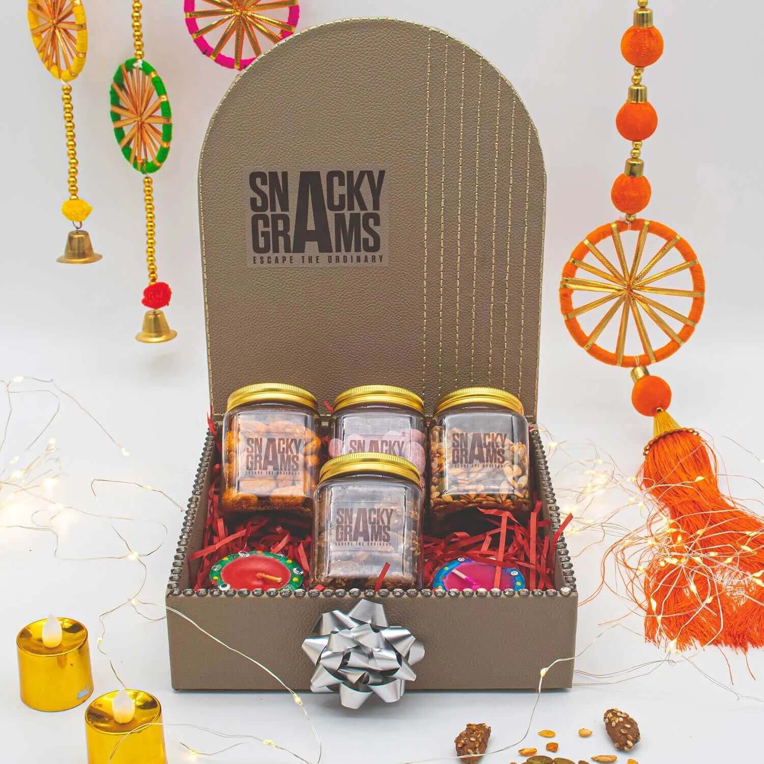 Snacky Grams gift set with jars and decorative elements on a light background