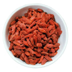 Dried red goji berries in a white bowl