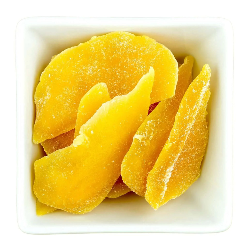 Dried mango slices in a white bowl