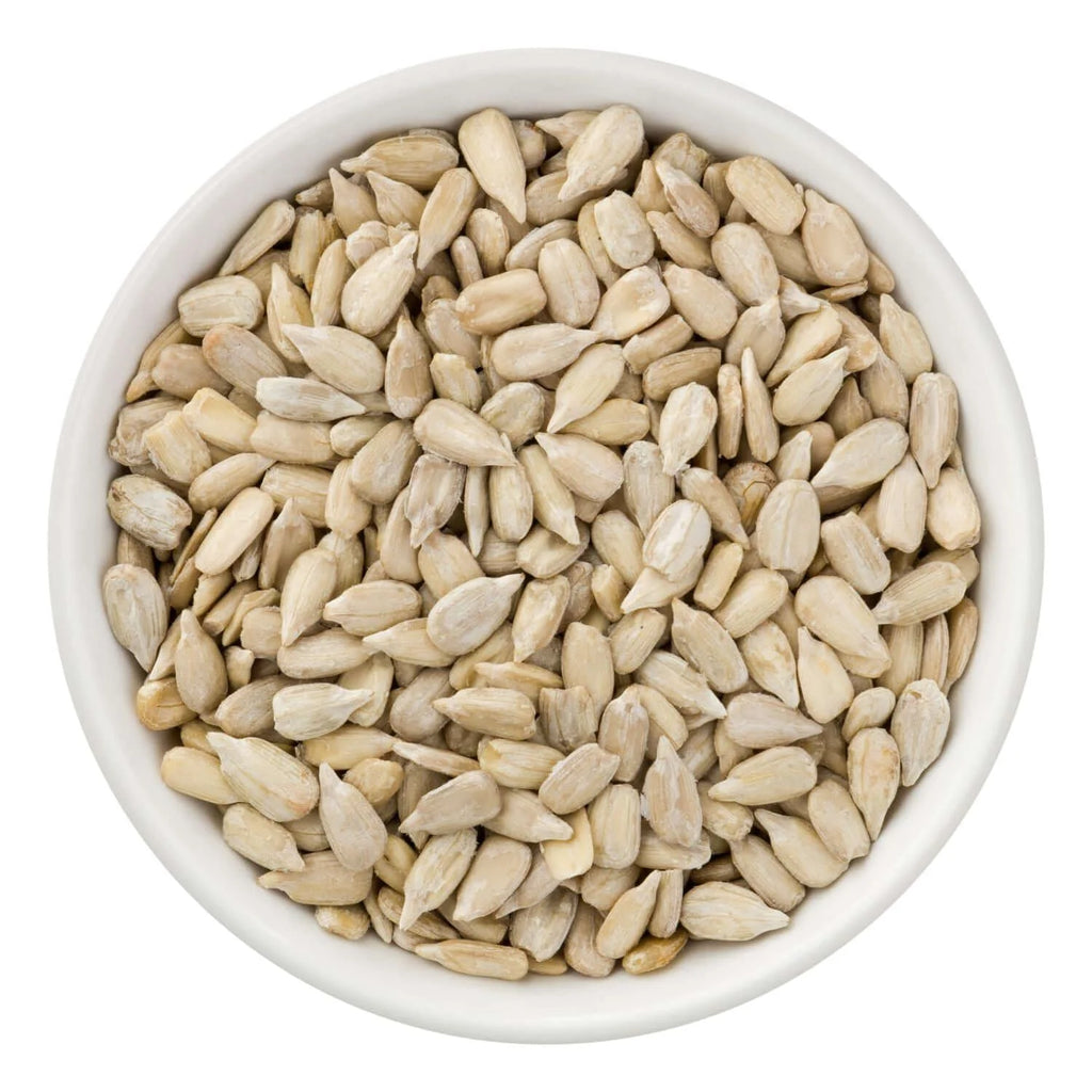 White bowl filled with sunflower seeds