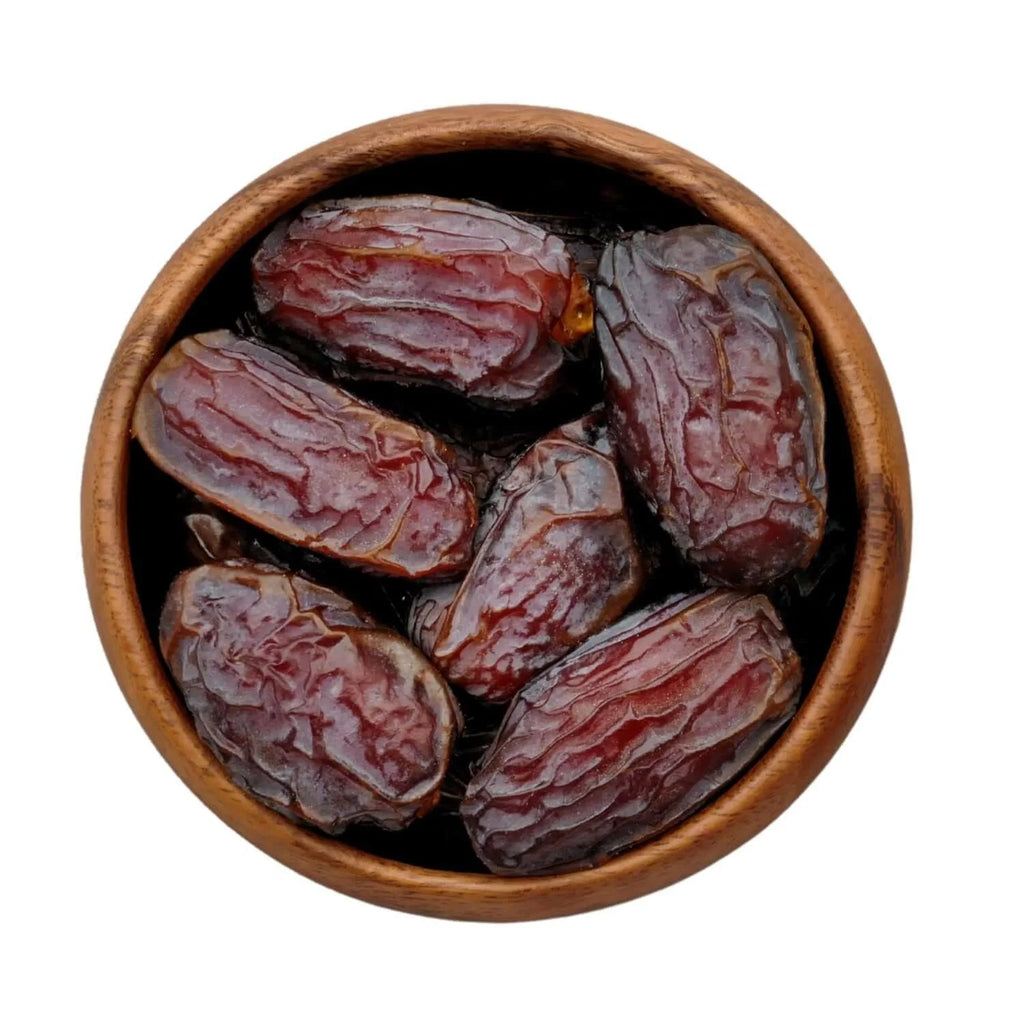 Wooden bowl filled with medjool dates