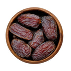 Wooden bowl filled with medjool dates