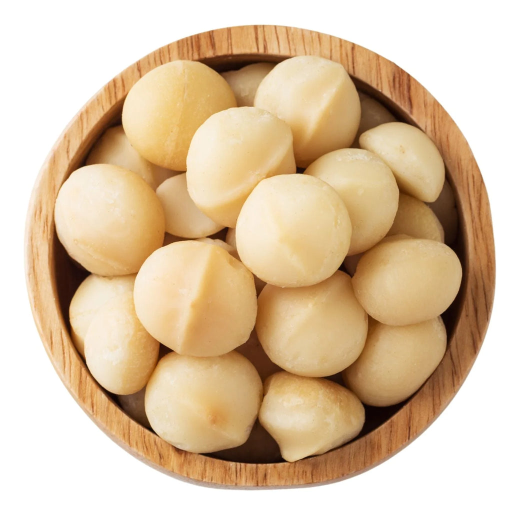 Wooden bowl filled with macadamia nuts