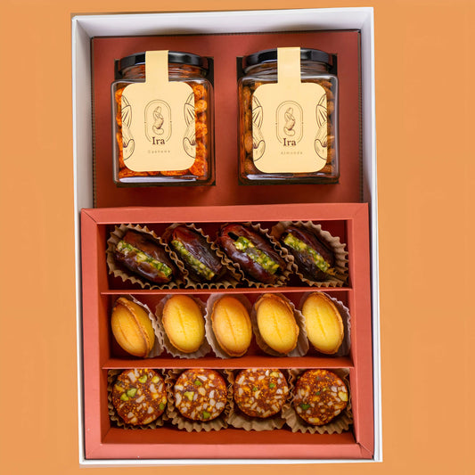 Gift set with jars labeled 'Ira' and assorted pastries on Diwali Ramadan& Christmas gift box
