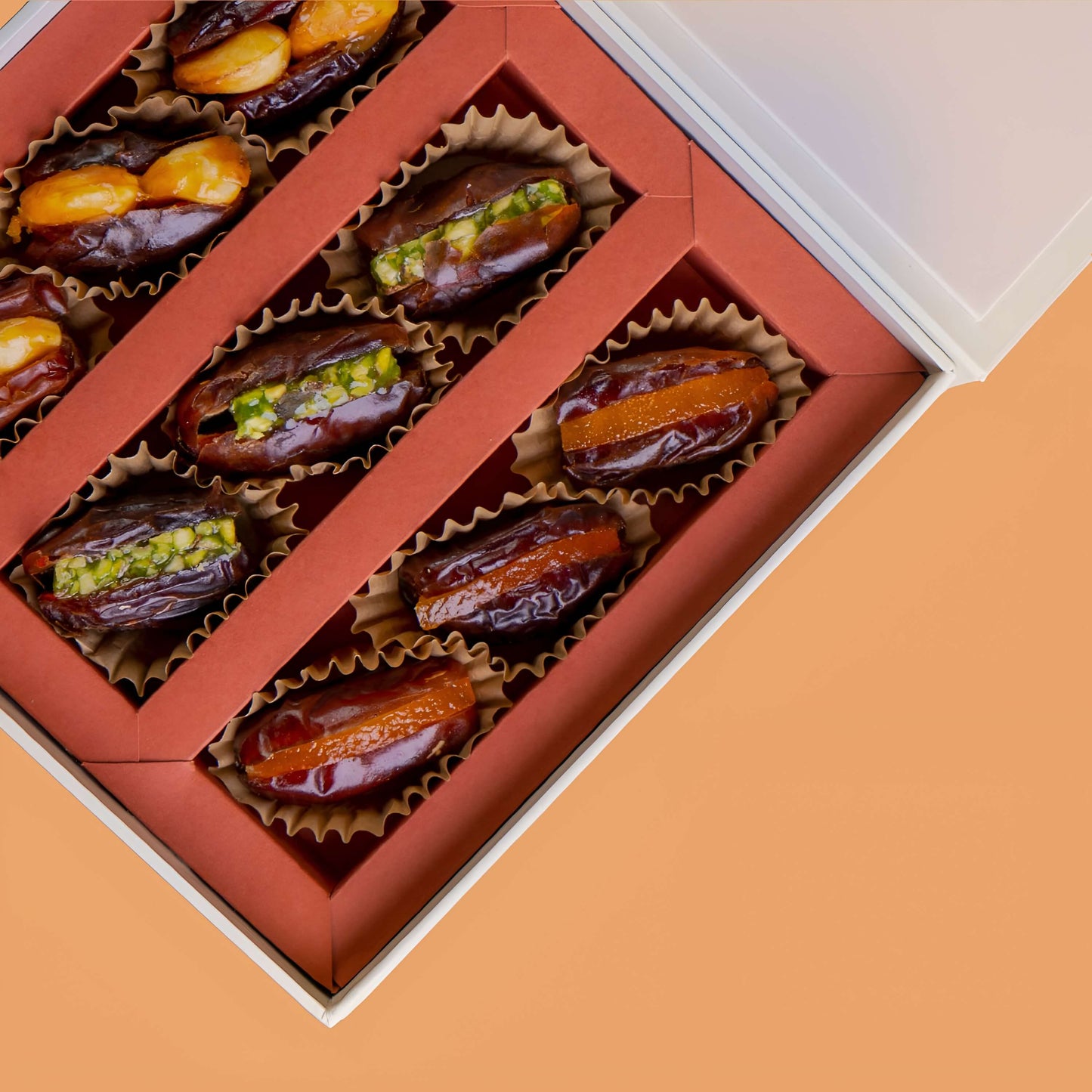 Box of dates with pistachios on a peach Diwali Ramadan& Christmas gift box