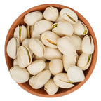 Wooden bowl filled with white pistachios