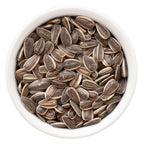 White bowl filled with shelled sunflower seeds