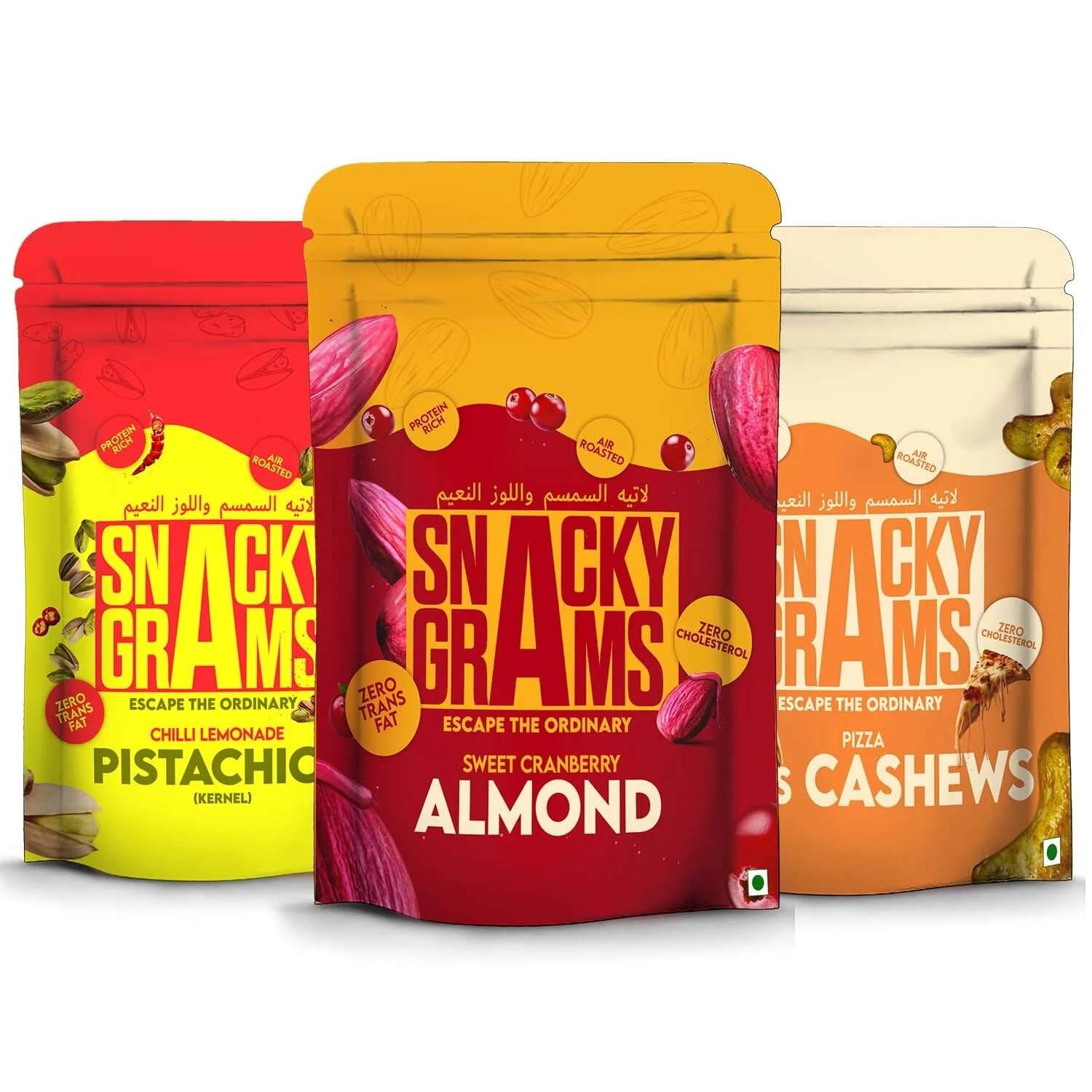 Three packages of Snacky Grams with different flavors on a white background